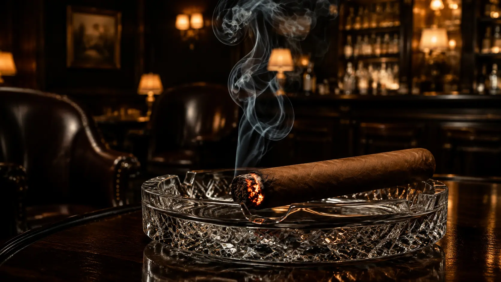 A glowing premium cigar resting in a crystal ashtray inside the lounge